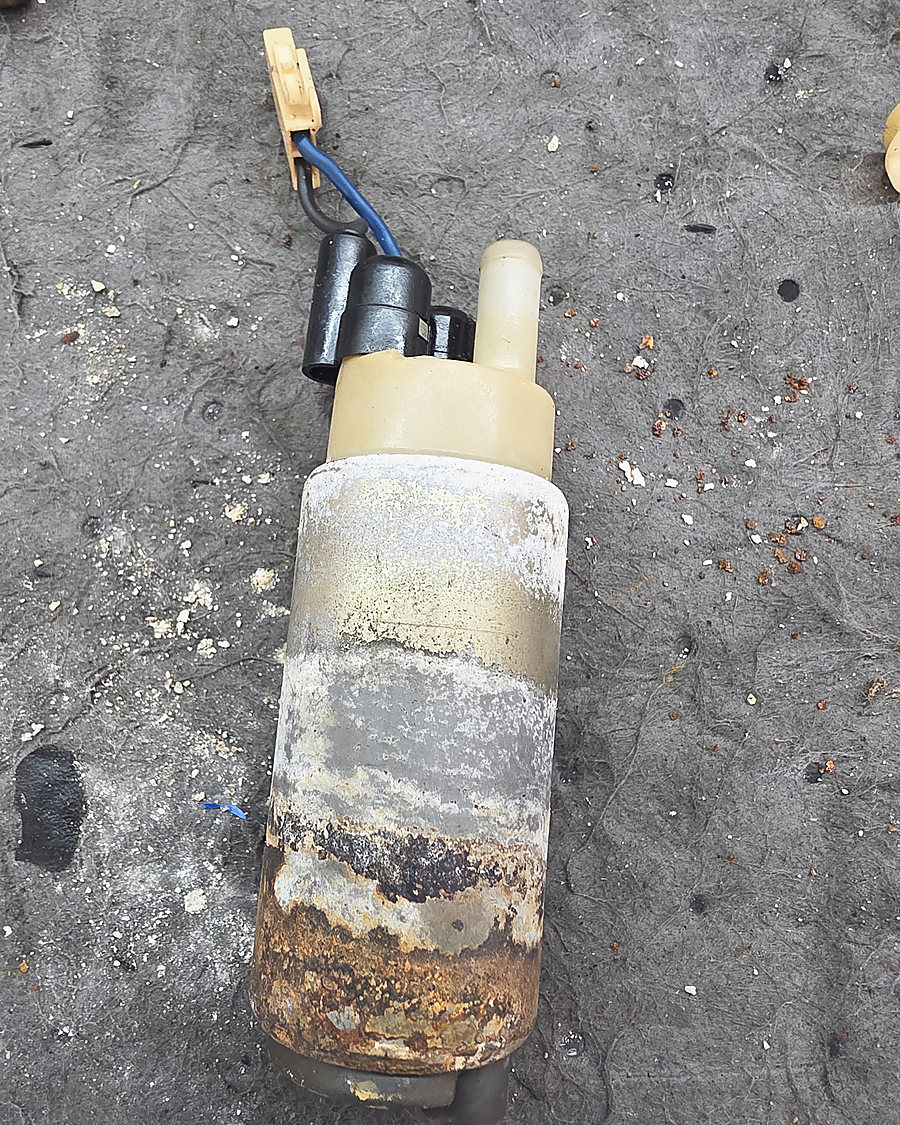 A corroded fuel pump, pulled out of a boat