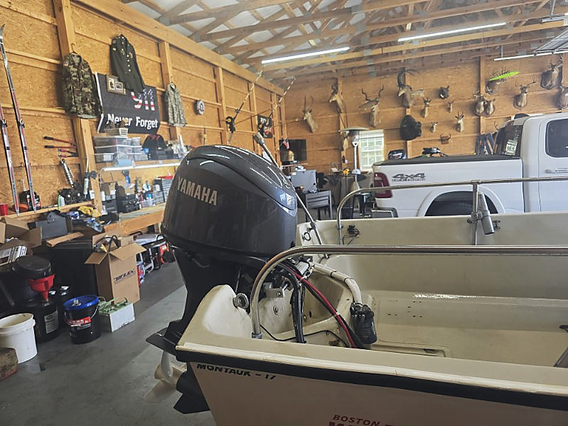 Inside the shop: the Yamaha outboard and the Montauk 17 decal on the hull